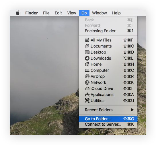 The Go dropdown menu options in Finder, with Go to Folder selected.