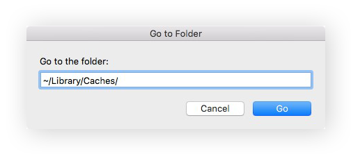 The Go to Folder window with ~/Library/Caches/ typed in the search box.