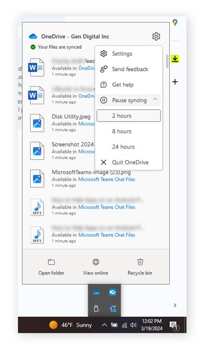 Pausing sync in OneDrive to speed up your PC.