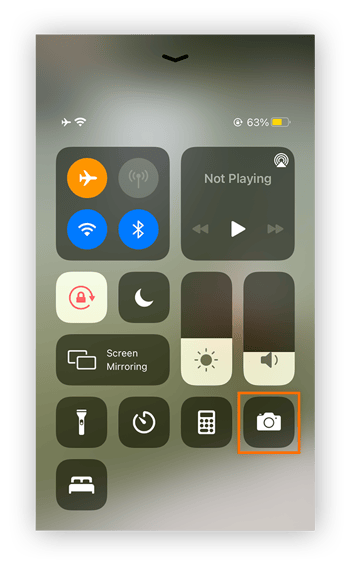 a view of the iPhone's control center, with the camera icon circled.
